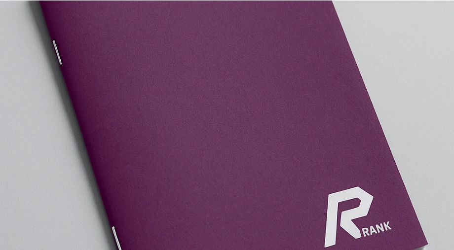 Rank Industries purple saddle stitched printed material